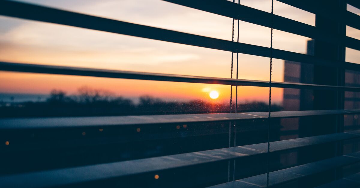 Dust caked on blind slats.