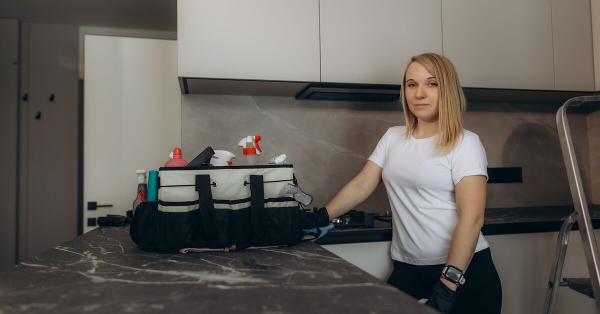Cleaner ready to service a kitchen oven